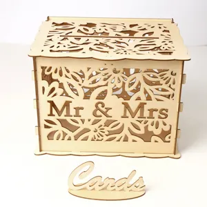 Detailed view of the wooden wedding card box featuring intricate cutout floral patterns.