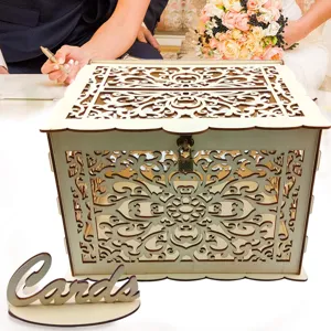 Detailed view of wooden wedding card box with hollow carved design, lock, and cards sign.