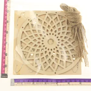 Wooden dream catcher hollow pattern laser cut craft with tassel and twine rope detail.