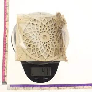 Wooden hollow dream catcher DIY craft kit with hanging rope and wooden pieces for home decor.