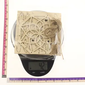 Wooden hollowed dream catcher ornament with tassel and twine, detailed view measurement.