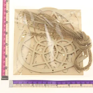 Wooden hollow dreamcatcher craft detail showcasing intricate laser cut patterns and texture.