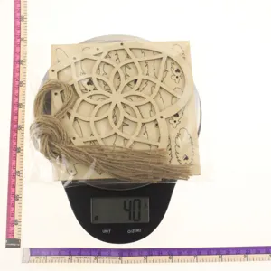 Wooden dream catcher detail showing size and weight on scale for handmade home decor crafts.