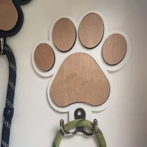 Wooden paw print wall hook detail view, showing polished texture and sturdy double hooks.