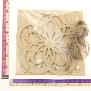 Wooden laser cut hollow pattern craft detail, natural wood material with twine cord attachment.