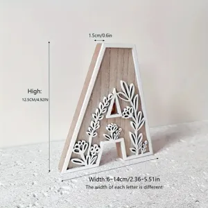 Wooden carved letter A decorative ornament with floral design, ideal for desktop display.