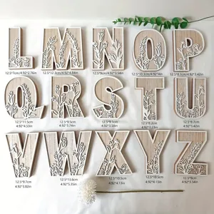Wooden decorative carved alphabet letters with floral pattern desktop ornament set for home decor.