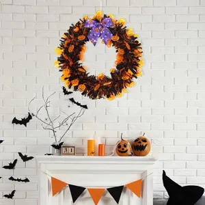 Halloween tinsel wreath decoration with pumpkins and bow, perfect for party hanging decor.
