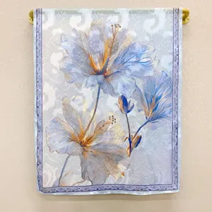 Detail view of the elegant blue floral print spring summer long silk scarf shawl for women.