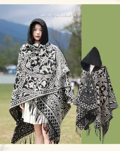 Detailed view of black and white ethnic hooded cloak, featuring intricate vintage woven patterns.