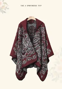 Detailed view of the vintage paisley pattern hooded knitted cape shawl for women.
