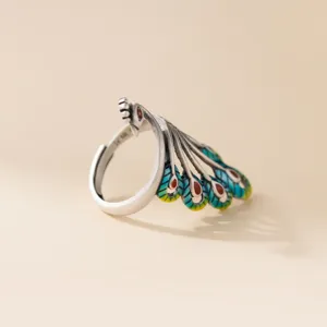 Close-up detail of vintage style sterling silver peacock open ring with exquisite craftsmanship.