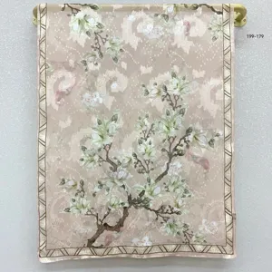 Detailed view of the vintage Chinese style floral printed silk scarf hanging on display.