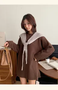 Cozy brown knitted sweater for women featuring a stylish large contrast collar and long sleeves.