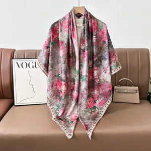 Retro floral silk square scarf with hand-rolled edges, elegant vintage shawl drape style.