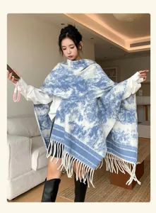 Detailed view of women's blue and white printed long scarf shawl with stylish fringe hem.