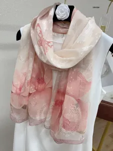 Detailed view of the elegant floral printed lightweight silk long scarf for women spring style.
