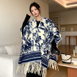 Stylish blue and white patterned women shawl, thick warm knitted winter cape and long scarf.