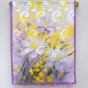 Detailed floral print silk scarf detail, showing exquisite purple and yellow flower pattern.