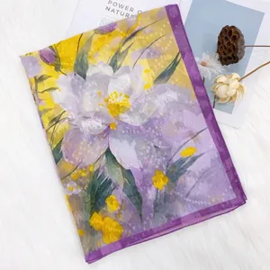 Floral print silk scarf detail, elegant purple and yellow floral pattern, soft lightweight shawl.