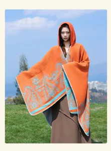 Ethnic style hooded cloak shawl for women, orange with blue floral pattern, warm and stylish.