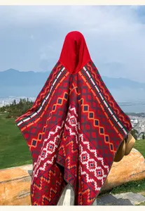Detailed view of bohemian style ethnic hooded poncho shawl with vibrant geometric patterns.