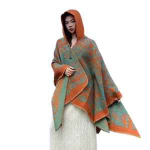 Stylish women's hooded cape, vintage orange and teal patterned winter warm shawl poncho.