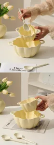 Detail showcase of cute cream ceramic pumpkin soup bowl with handle and matching spoon scene.