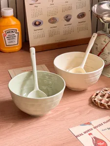 Ceramic cereal bowl set with spoon, glazed pastel finish for breakfast yogurt or salad.