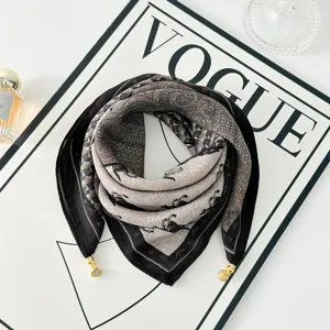 Close-up detail of vintage printed square scarf with horse motifs and metal magnetic clasps.
