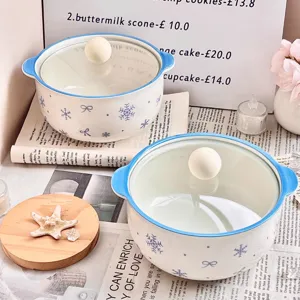 Ceramic soup bowl set with glass lid, blue rim and cute snowflake bow pattern for home use.