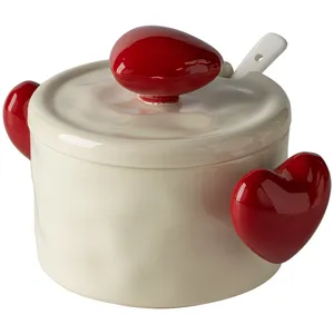 Charming ceramic lard jar featuring cute red heart handles, lid, and spoon detail view