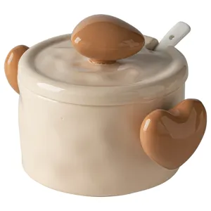Cute ceramic jar with lid and spoon, lovely heart-shaped handles, perfect kitchen tableware.