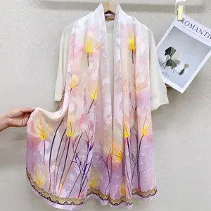 Detailed closeup of women floral printed lightweight silk scarf shawl elegant pink design