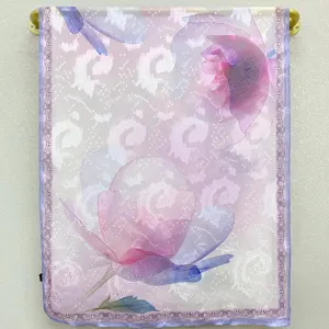 Detailed view of the sheer floral silk scarf featuring elegant garden print and lace trim.