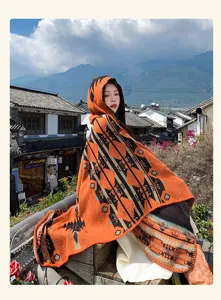 Ethnic style knit hooded cape shawl with geometric patterns, perfect retro outdoor wear outfit.