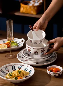 Japanese style ceramic tableware set with hand-painted floral patterns, elegant home dining.