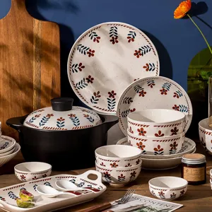 Japanese style ceramic tableware set featuring hand-painted floral plates and bowls.
