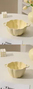 Cream ceramic soup bowl with handles, cute pumpkin shaped bowl for daily household use, detail view.