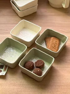 Ceramic square dipping bowls set for soy sauce, snacks, and seasoning, minimalist tabletop style.