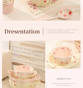 Detailed view of ceramic bowl showing cute heart pattern, double handles and neat stacking.