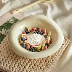 Elegant ceramic bowl for yogurt, breakfast, oats, or fruit salad. Stylish tabletop setup.