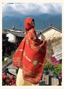 Women ethnic hooded knitted cape shawl, retro geometric patterned cloak for outdoor wear.