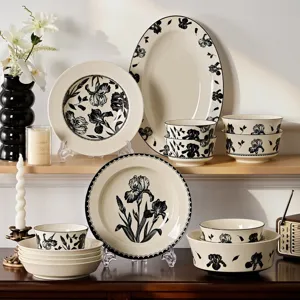 Black and white floral ceramic dinnerware set including plates and bowls for home kitchen dining.