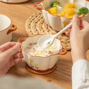 Cute ceramic pumpkin bowl set with spoon, underglaze floral design for home kitchen dining use.