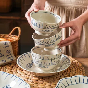 Japanese style ceramic bowl set with blue fish pattern, elegant tableware for home kitchen use.