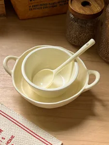 Korean style aesthetic cream yellow ceramic bowl and spoon set tableware detail view