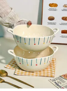 Detailed view of ceramic double-ear soup bowl with hand-painted blue stripes and colorful dots.