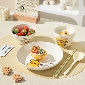 Close-up detail of cute cartoon ceramic bowl and plate set with nice tableware display.
