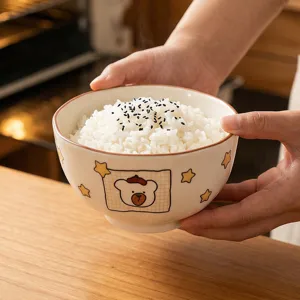 Cute cartoon ceramic rice bowl with cute bear pattern for household kitchen dining table.
